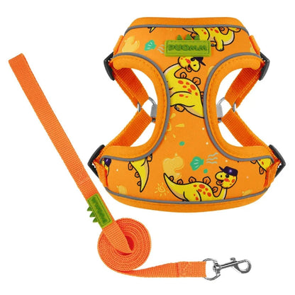Harnais orange avec motifs dinosaures pour chiens. Vendu avec sa Laisse assortie. Confortable, convient aux petits chiens, chihuahuas, ou aux chats. Vendu dans la boutique « Mon Petit Chihuahua »

