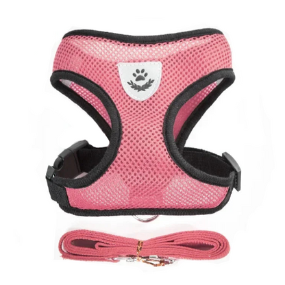 Harnais rose clair et noir et sa laisse assortie pour petit chien. Réglable et confortable, convient aux petits chiens, chihuahuas, ou aux chats.